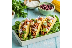 Image Three plant-based meat tacos.